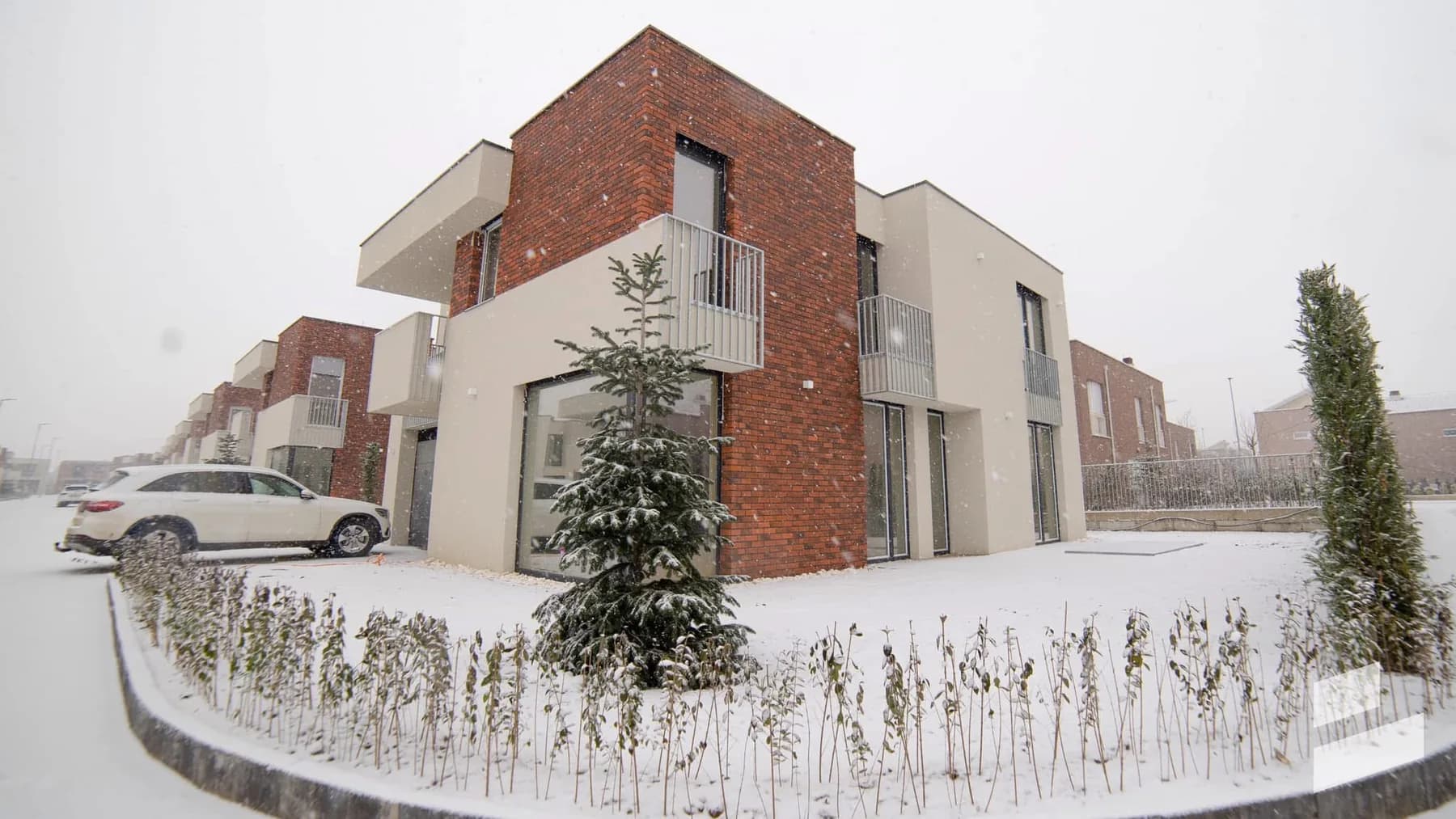 Brick and cream homes in winter